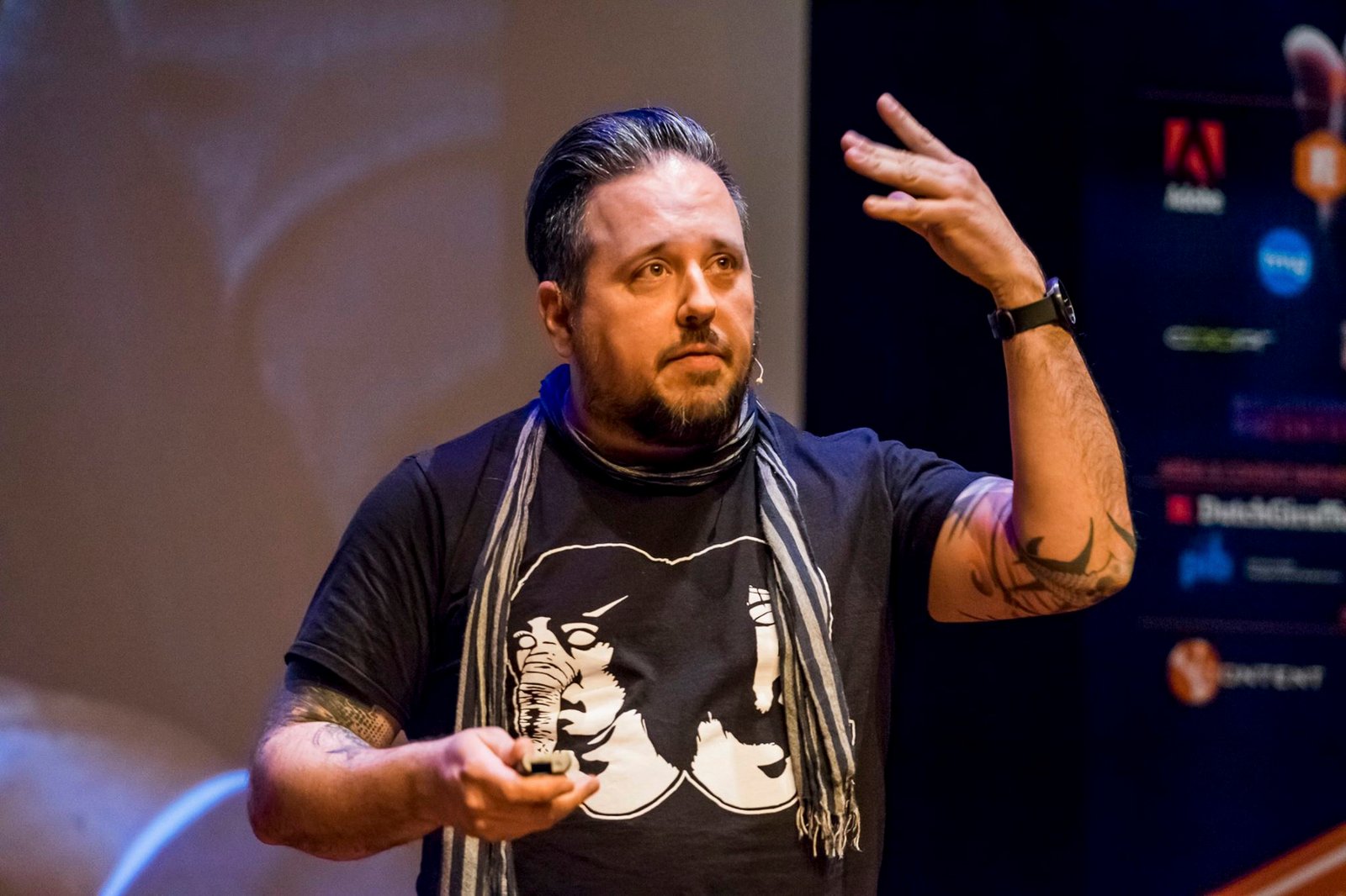 Jason Miller speaking on stage